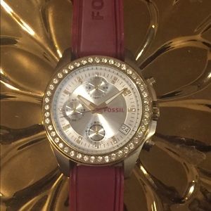 Fossil gold-tone watch with red silicon strap